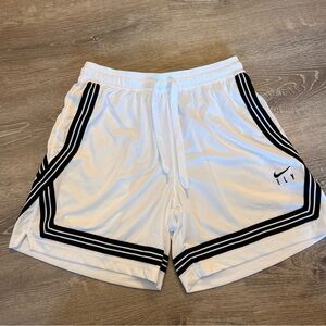 NIKE. Black and white basketball shorts.